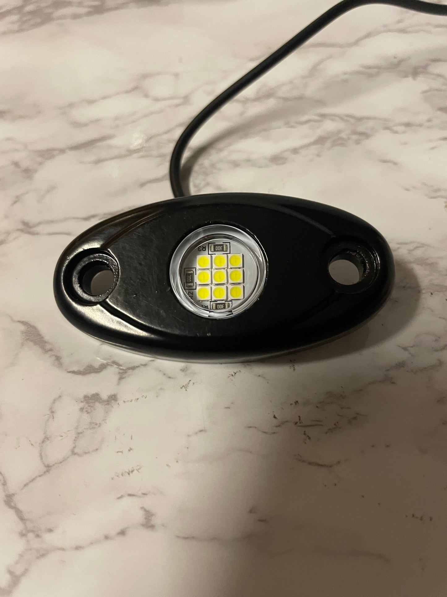 Battery powered rock light with switch