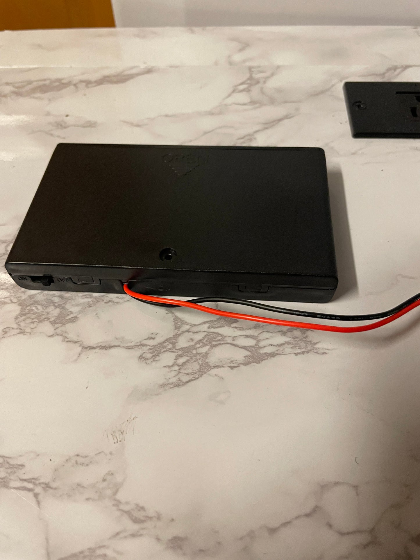 Battery powered rock light with switch