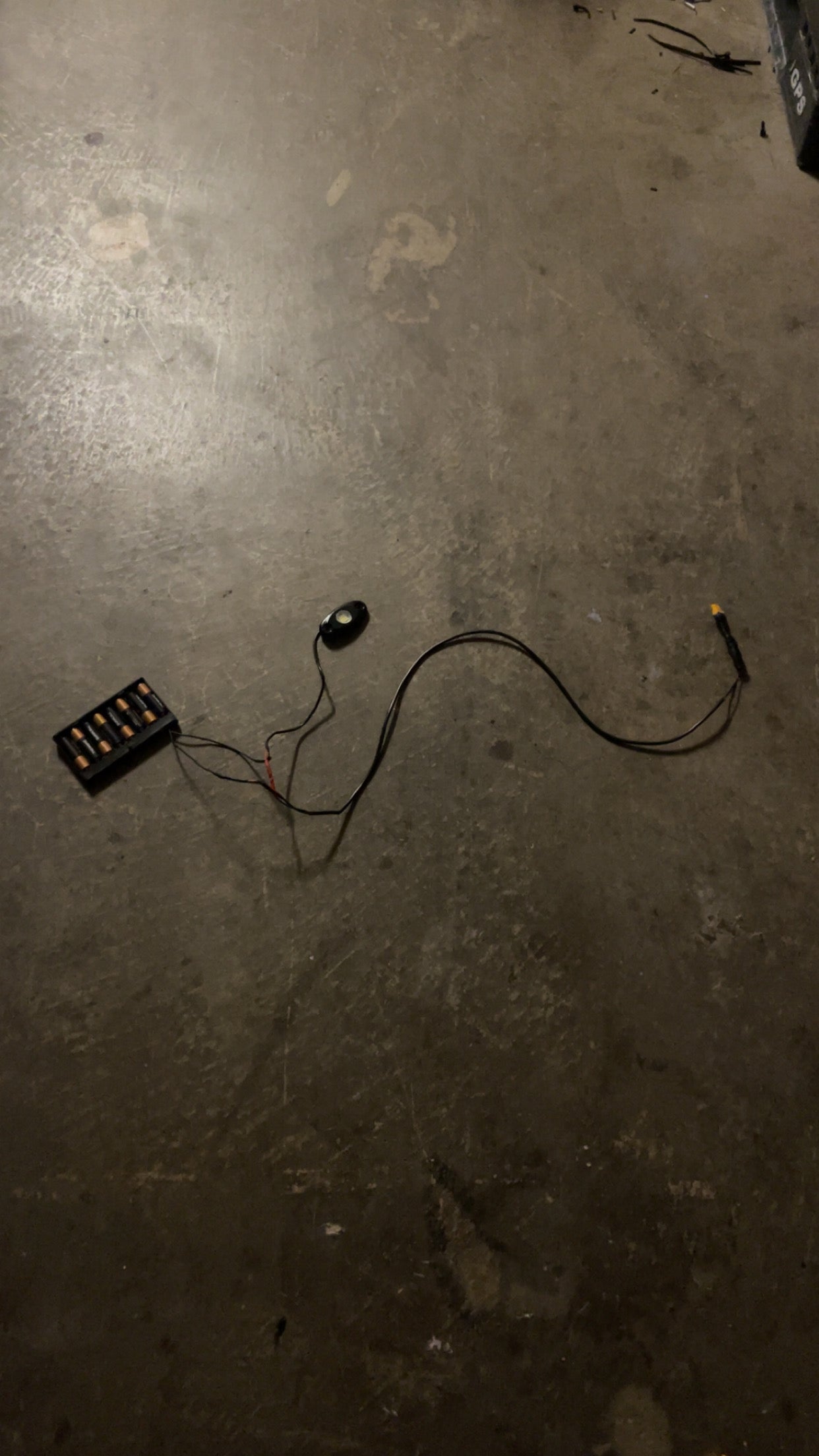 Hidden battery powered rock light switch