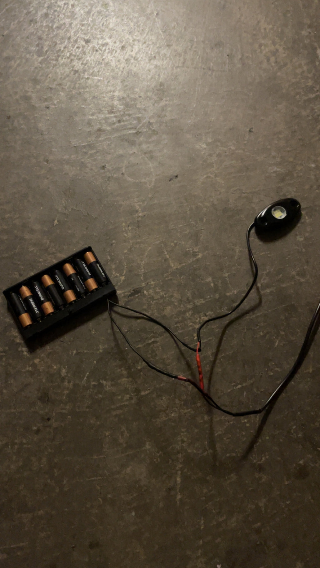 Hidden battery powered rock light switch